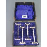 A boxed set of silver knife rests Sheffield 1908/09 - Length 75mm - total weight approx 3.