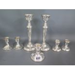 A pair of silver candlesticks - Height 18cm - two pairs of dwarf silver candlesticks and a single