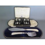 A set of six boxed silver teaspoons and nips and a boxed plated serving set with mother of pearl