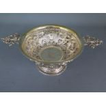 A Continental silver ornate twin handled bowl - Height 7cm x 21cm wide - approx weight 5.