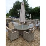 A Bramblecrest Patagonia 120cm round table with four armchairs,