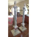 A pair of silver plated Corinthian column table lamps