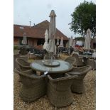 A Bramblecrest Sahara 150cm round table with lazy susan, six armchairs,