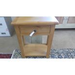 An oak side table with a single drawer - ex display - as new - Width 63cm x Height 80cm