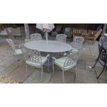 A Bramblecrest Rome elliptical table with six armchairs,