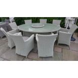 A Bramblecrest Biscay 212cm x 150cm round table with lazy susan, eight armchairs,