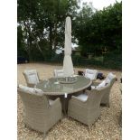 A Bramblecrest Oakridge 220cm elliptical table with two recliners, four armchairs,