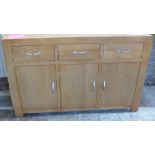 An ex display oak sideboard - Width 135cm - as new