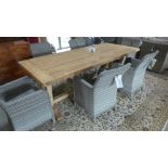 A Bramblecrest Kuta 240cm teak table with eight armchairs