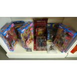 A collection of ten boxed figures including Charlie's Angels and a K9 key ring