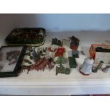 A collection of lead farm animals and other figures