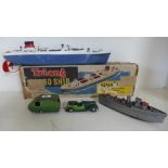 A Minic tinplate tourer and caravan - play worn - a Tri-ang cargo ship with box and a destroyer