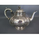 An ornate embossed silver teapot - Sheffield 1895/96 - Martin Hall and Co - Weight approx. 11.