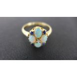 An 18ct gold yellow opal sapphire and diamond cluster ring size P - total weight approx 3.