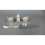 A pair of silver bucket salts with spoons,