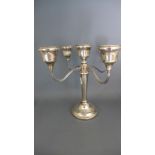 A silver four branch candelabra with filled base - Height 23cm - Birmingham 1975 - maker ATC - in
