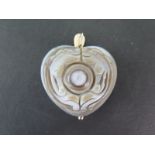 A wall carved jade heart pendant with a gold metal mount - 5cm x 4cm - good overall condition