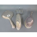 A Continental silver three piece dressing set marked 835 and a silver toast rack - toast rack bent,