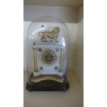 A 19th century French alabaster mantle clock under glass dome - the clock decorated with ormolu