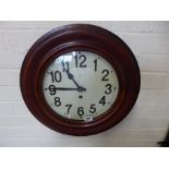 A beechwood wall clock with a 10" painted dial