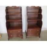 A pair of modern mahogany waterfall bookcase with a base cupboard - Height 128cm x 58cm x 46cm