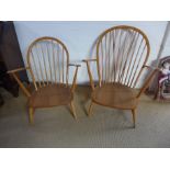 Two Ercol light elm stick back fireside chairs