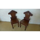 A pair of 19th century mahogany hall chairs