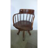 A late Victorian ash and elm swivel desk chair