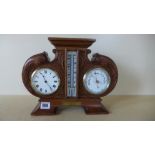 An early 20th century desk clock/thermometer/barometer oak carved case, presented to Capt.