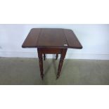 A 19th century mahogany drop leaf side table with a drawer on turned legs - Height 70cm x 68cm x