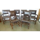 A set of six oak dining chairs with leather seats including two carvers