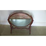 A mahogany oval dressing mirror - Height 58cm x 66cm