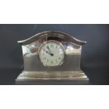 A silver plated mantle clock by Walker & Hall engraved to back - Presented to Mr Ronald Hernsby,