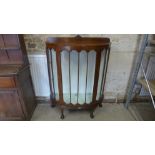 An early 1900's bowfronted walnut display cabinet - Height 123cm x 92cm x 35cm