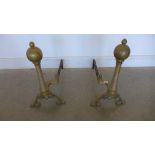 A pair of brass and iron fire dogs - Height 53cm x Length 56cm