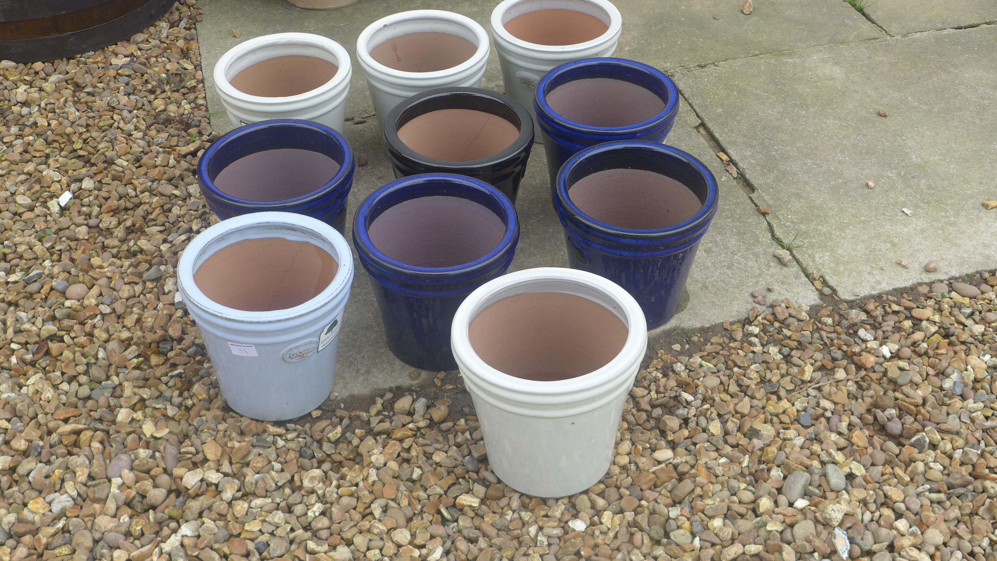 Ten assorted glazed plant pots - diameter 20cm