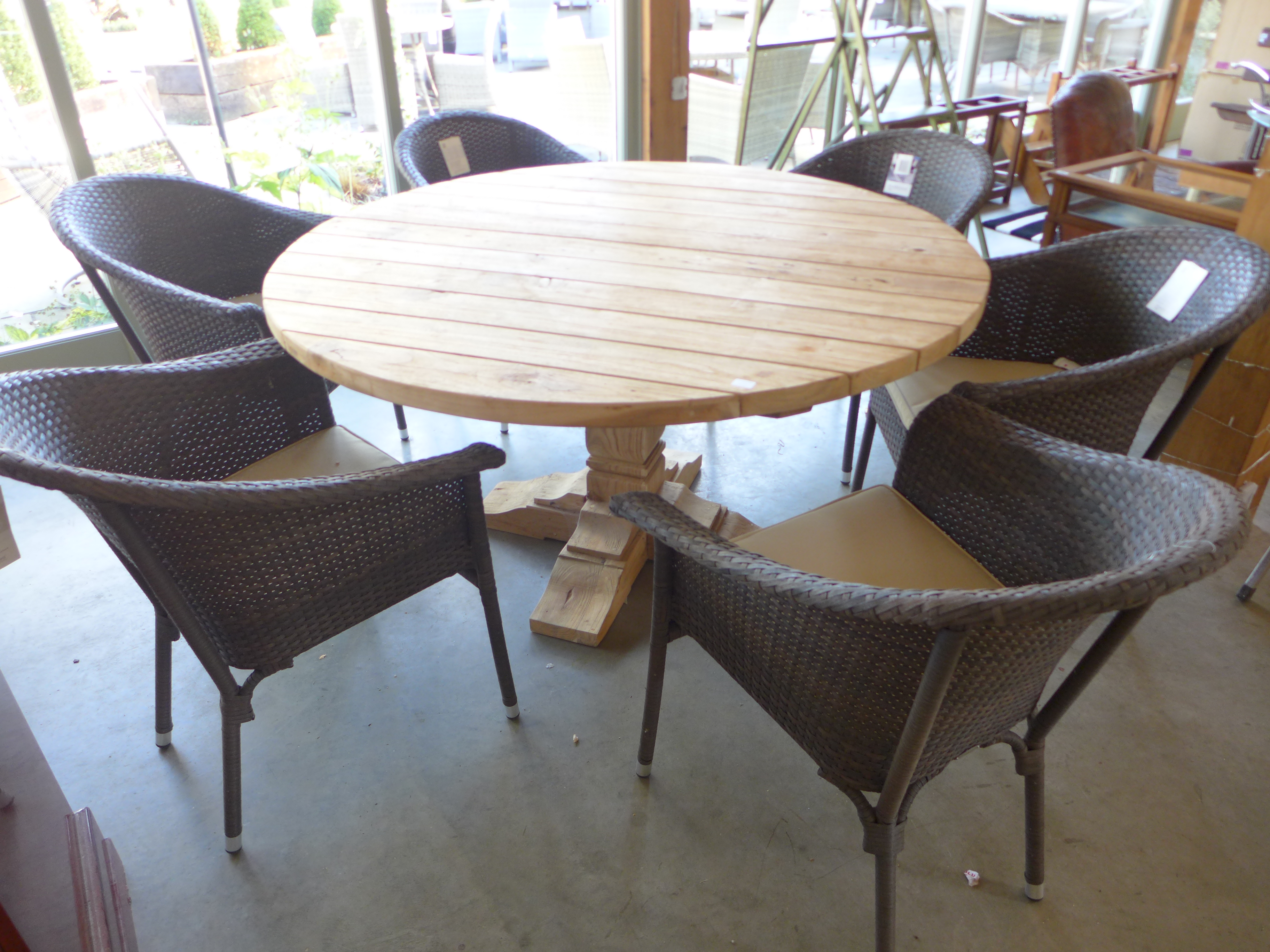 A Bramblecrest Kuta teak dining table - 180cm x 100cm and six Rio armchairs