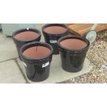 Four black glazed pots - Diameter 33cm