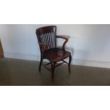 An Edwardian mahogany desk chair