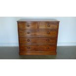 An early Victorian mahogany two over three chest of drawers on a plinth base - 124cm x 56cm x 113cm