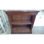 A modern mahogany bookcase with an adjustable shelf