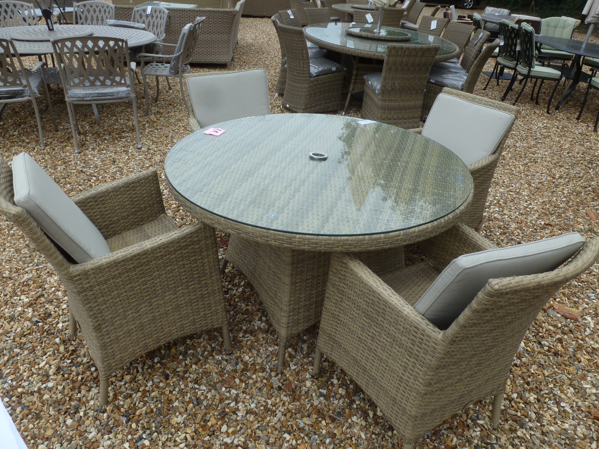 A Bramblecrest Cotswold round table with four armchairs