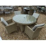 A Bramblecrest Cotswold round table with four armchairs