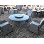 A Bramblecrest Oakridge round table with two reclining armchairs and two normal armchairs,