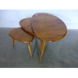 An Ercol nest of three "Pebble" elm tables