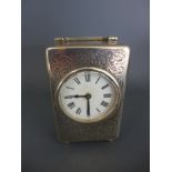 An ornate silver carriage clock by Percy Edwards Ltd.