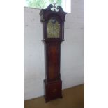 A mahogany 8 day striking longcase clock with rocking ship movement and arched 12 inch brass dial