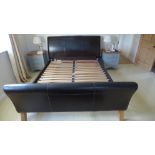 A modern ex John Lewis faux leather bed in good condition - 5ft wide