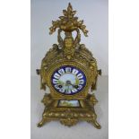 A Continental ormolu and porcelain mantel clock,