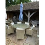 A Bramblecrest Cotswold 140cm round table with six armchairs,